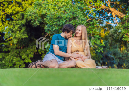 Pregnant woman and her husband spend quality time together outdoors, savoring each other's company and enjoying the serenity of nature Pregnant woman and her husband spend quality time together outdoors, savoring each other's company and enjoying the serenity of nature 113416039