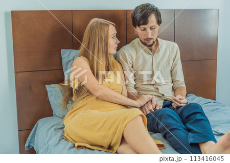 Concerned husband anxiously worries about his wife's pregnancy, seeking reassurance and support 113416045
