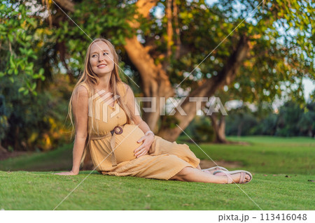 pregnant woman finds joy and serenity, relishing a tranquil moment outdoors during her pregnancy journey pregnant woman finds joy and serenity, relishing a tranquil moment outdoors during her pregnancy journey 113416048