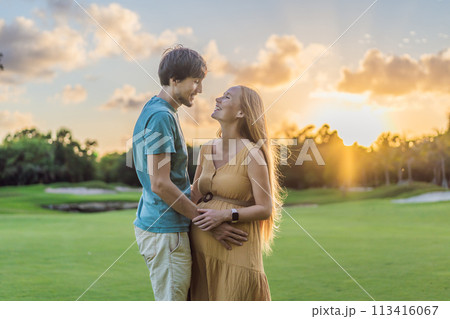 A blissful moment as a pregnant woman and her husband spend quality time together outdoors, savoring each other's company and enjoying the serenity of nature 113416067