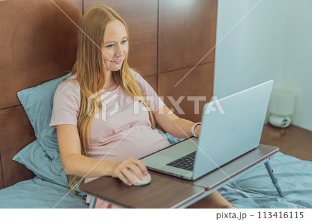 Pregnant woman working on laptop. Expectant woman efficiently works from home during pregnancy, blending professional commitment with maternal duties 113416115