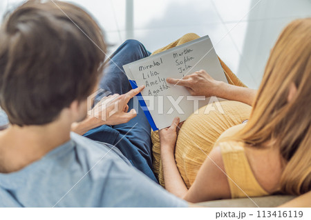 Expectant couple joyfully selects a name for their unborn daughter, savoring the special moment of choosing a meaningful identity for their growing family Expectant couple joyfully selects a name for their unborn daughter, savoring the special moment of choosing a meaningful identity for their growing family 113416119