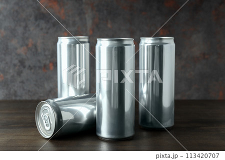 Tin cans for drinks on a dark background 113420707