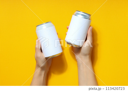 Tin cans for drinks on a light background 113420723