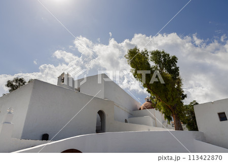 Whitewashed Puig de Missa church, 16th century, in Ibiza with bell tower, clear sky 113422870