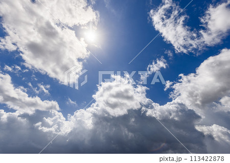 Brilliant blue sky background featuring contrast and depth with cumulus clouds 113422878