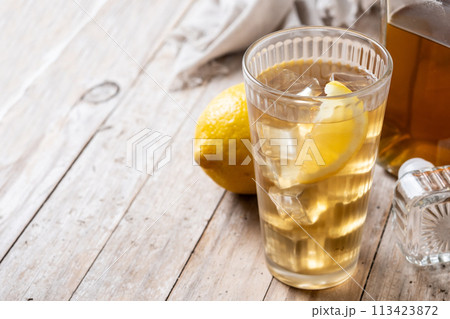 Highball, Whiskey with soda and lemon beverage on wooden table 113423872