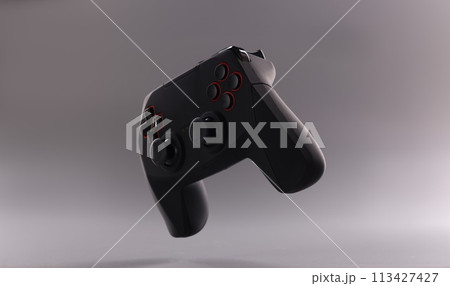 Black plastic wireless gamepad on gray background 113427427