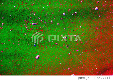 Beautiful horizontal texture of a part of an old concrete wall with holes painted in purple and blue pink in the photo, the color scheme has been changed. 113427741