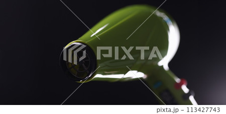 Green modern trendy hair dryer on gray background Green modern trendy hair dryer on gray background 113427743