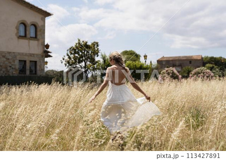 Full shot woman holding dress 113427891