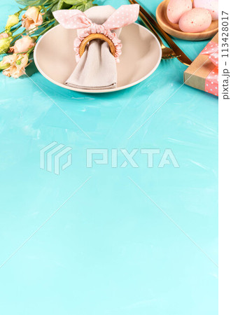 Easter pastel peach table menu template on turquoise. Table setting idea. Vertical format Copy space 113428017