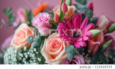 Bouquet of Pink and Orange Flowers on a Table 113428354