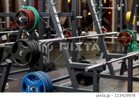 Exercise equipment in an empty gym Exercise equipment in an empty gym 113429976