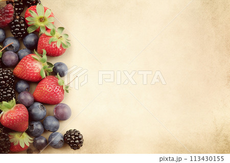 An assortment of fresh blackberries and raspberries isolated on white background. 113430155