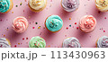 Flat lay of colorful pastel birthday cupcakes, pastel pattern background 113430963