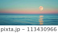 Full moon over blue sea water in pastel sky 113430966