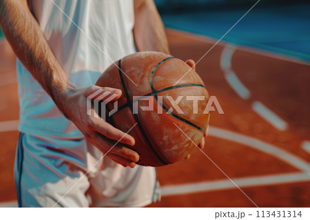 Basketball player holds basketball ball on a court. Generative AI Basketball player holds basketball ball on a court. Generative AI 113431314