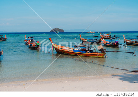 Wooden boat on the beach on the island 113439214