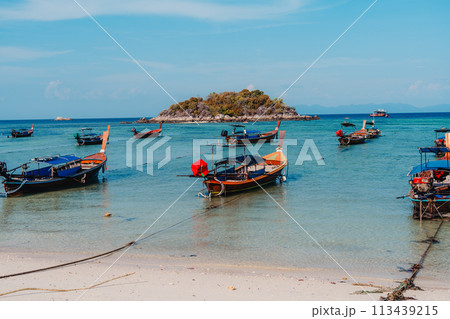 Wooden boat on the beach on the island 113439215