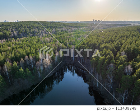 Spring or autumn lake in forest. Aerial view of lake in spring or autumn 113439249