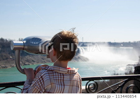 Coin operated telescope overlooking Niagara Falls. Coin operated telescope overlooking Niagara Falls. 113440854