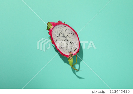 One half of dragon fruit on blue background, top view 113445430