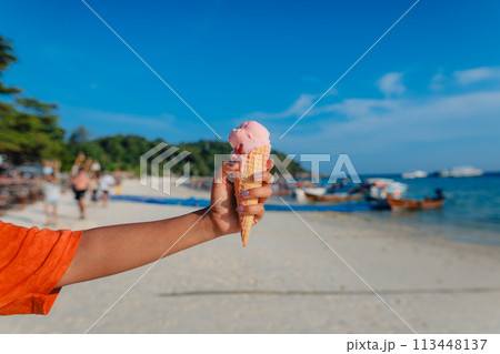 Ice cream cone at the beach in summer Ice cream cone at the beach in summer 113448137