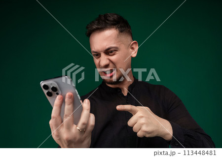 Man Holding Cell Phone in Right Hand 113448481