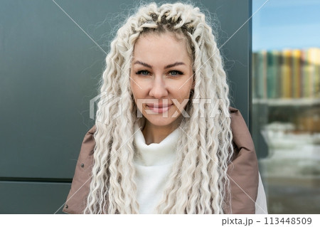 Woman With Long Blonde Hair Wearing a Jacket Woman With Long Blonde Hair Wearing a Jacket 113448509