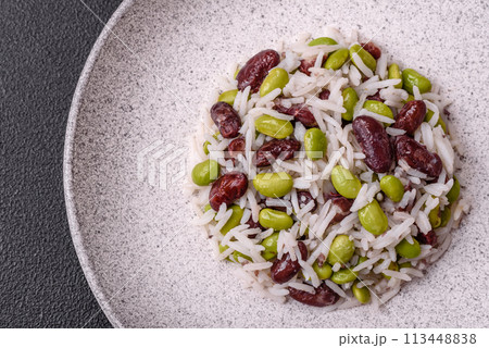 Delicious white cooked rice with green edamame beans with salt and spices 113448838