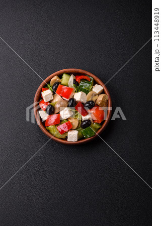 Delicious fresh juicy salad of sweet peppers, cheese, olives, tomatoes, cucumbers 113448919