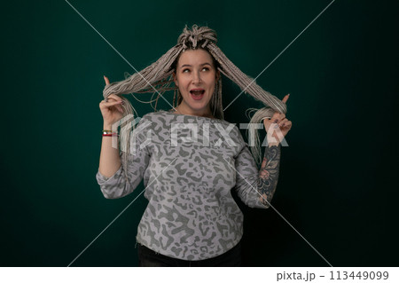 Woman Holding Hair in Front of Head 113449099