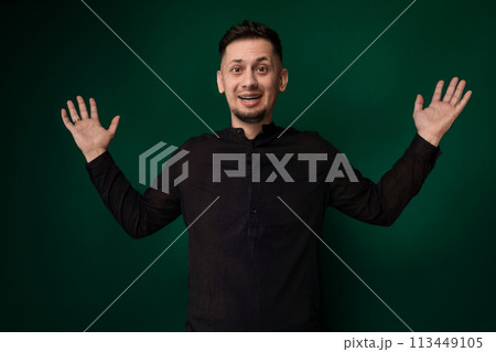 Man Standing in Front of Green Background 113449105