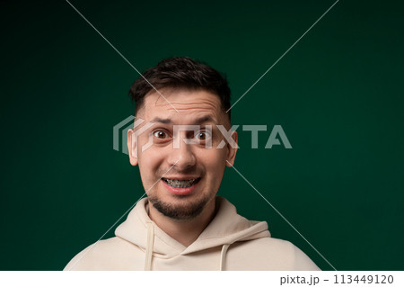 Man in a Hoodie Making a Funny Face Man in a Hoodie Making a Funny Face 113449120