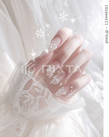 Nail art The snowflake design is made of tiny crystals, giving the nails a sparkling and elegant appearance Nail art The snowflake design is made of tiny crystals, giving the nails a sparkling and elegant appearance 113449381