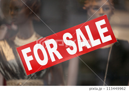 For sale banner in a window shop 113449962