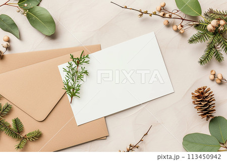 Mockup A white card with a green leaf on it sits on top of a brown envelope. Concept of simplicity and natural beauty 113450942