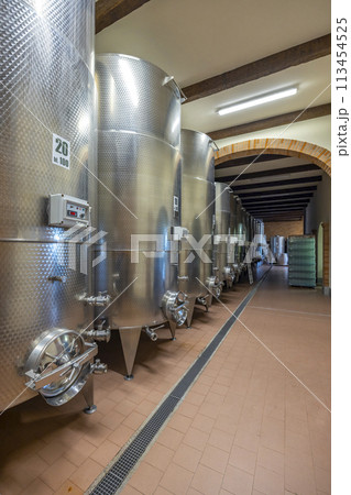 Modern production wine cellar with stainless steel tank, Canale, Piedmont, Italy 113454525