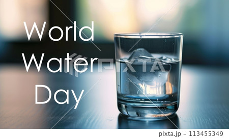 Clear glass of water with ice on blue table. Isolated on blue background. Clear glass of water with ice on blue table. Isolated on blue background. 113455349