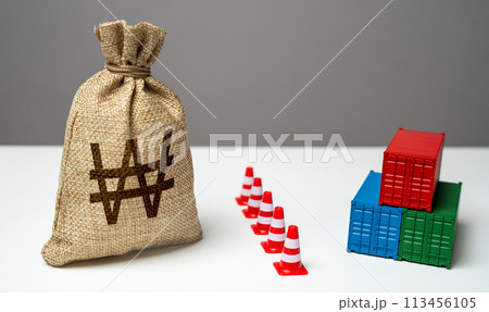 Shipping containers with goods and south korean won money bag are separated by a barrier. Logistics difficulties. Economic sanctions. Break a trade deal. Naval blockade. Shipping containers with goods and south korean won money bag are separated by a barrier. Logistics difficulties. Economic sanctions. Break a trade deal. Naval blockade. 113456105