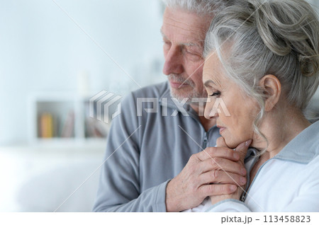 Close-up portrait of sad senior couple posing Close-up portrait of sad senior couple posing 113458823