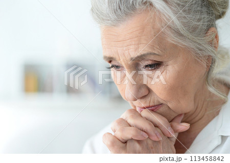 Close up portrait of a sick senior woman Close up portrait of a sick senior woman 113458842