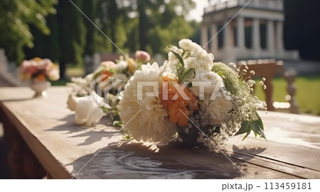 Flower bouquet at the outdoor dinning table as decoration for wedding reception dinner event. 113459181