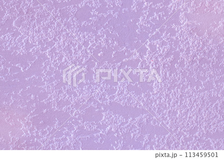 Light pink berry color paint on rough plaster wall solid stucco surface texture background 113459501