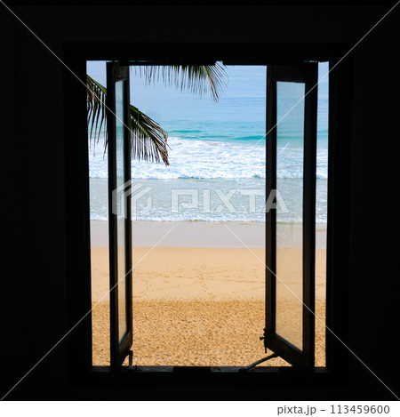 View from the window to the tropical beach. View from the window to the tropical beach. 113459600