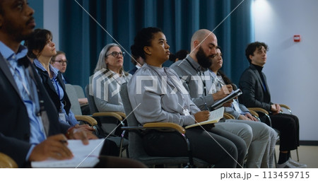 Media representative stands up and asks questions during interview Media representative stands up and asks questions during interview 113459715