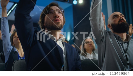 Diverse media workers raise hands during press campaign in the conference room 113459864