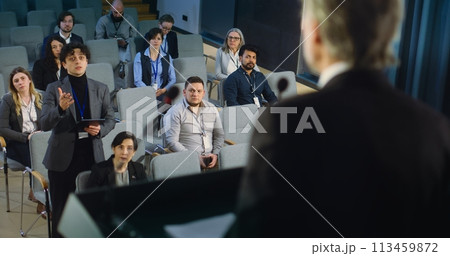 Back view of politician or activist pronouncing speech during press campaign 113459872
