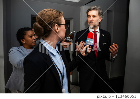 Busy republican politician gives interview for TV news in corridor Busy republican politician gives interview for TV news in corridor 113460053
